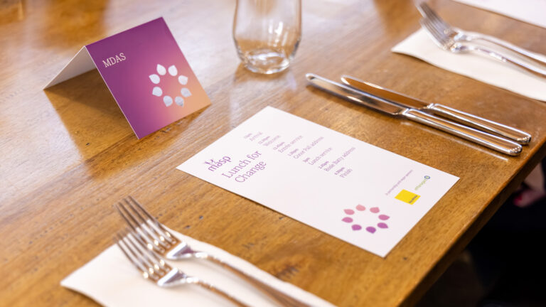 MASP luncheon collateral designed by Admedia, featuring die cut placecard and event program