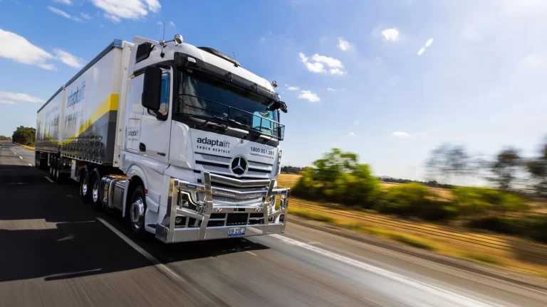 An Adaptalift truck driving on a highway