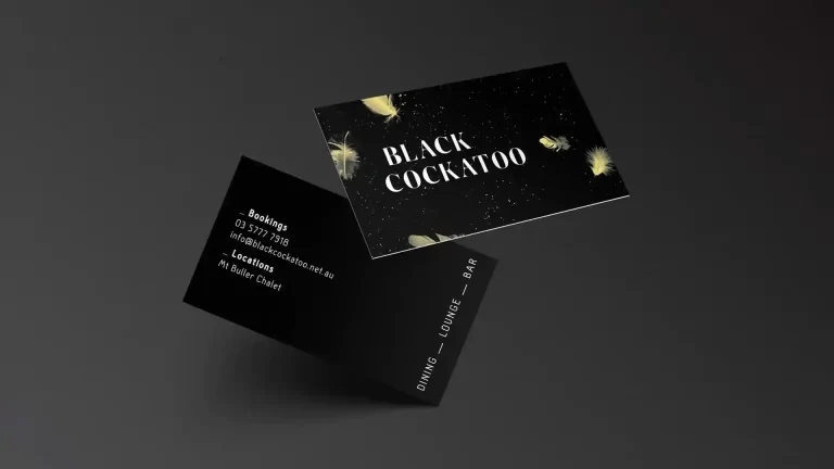 Black Cockatoo business cards with black background and gold feather design elements