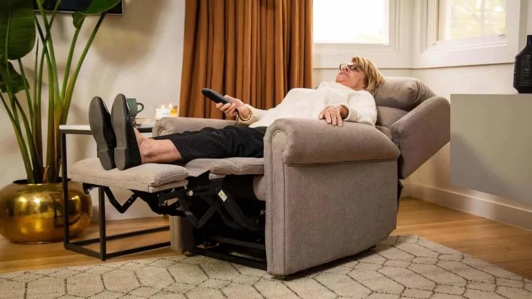 Woman relaxing in a K Care recliner lift chair, showcasing product comfort and functionality in a lifestyle shot by Admedia for content creation.