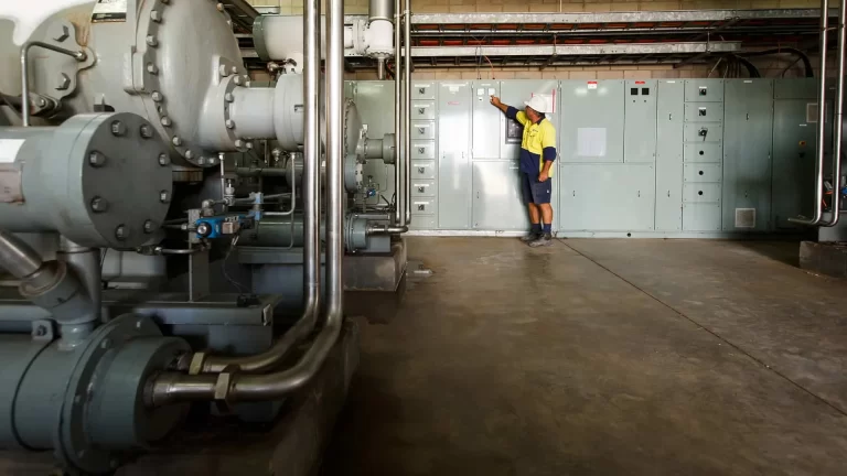 Admedia content creation: a Lee & Golding electrician inspecting a large industrial electrical panel, showcasing their expertise in industrial services.
