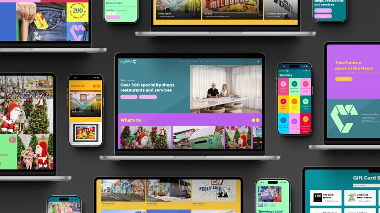 Collage of laptops and phones displaying vibrant colourful pages on the Mildura City Heart website, designed and built by Admedia